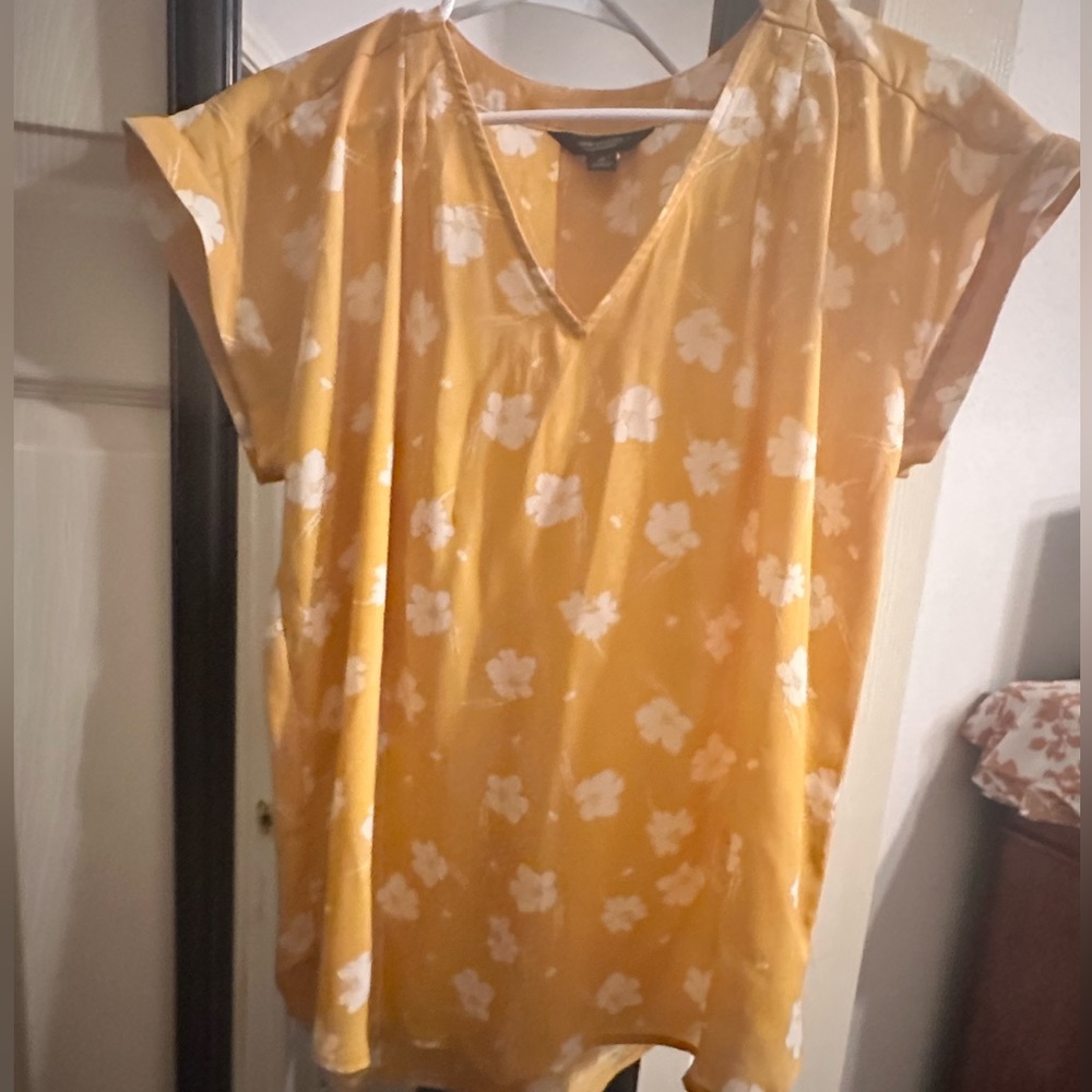 Dressy yellow flowered blouse. Worn once. Cute with jeans.